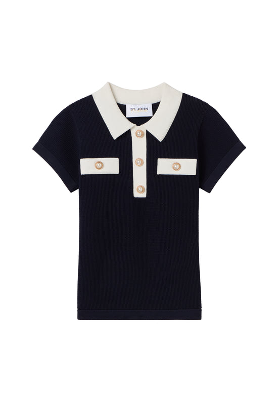 Navy blue St John Knits Malbon polo shirt with white collar and buttons on a white background